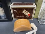 a soap that is sitting on a table next to a box
