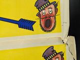two pictures of a man with an arrow and a man with a top hat
