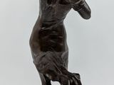 statue of a woman with a bird in her hand