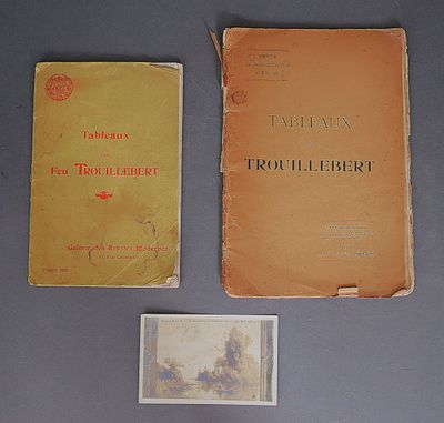 several books are sitting on a table with a picture of a man