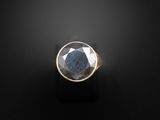 a close up of a ring with a stone in it