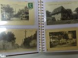 an old photo album with a lot of old photos on it
