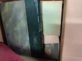a box full of books sitting on the floor