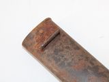 an old rusted metal pipe on a white surface