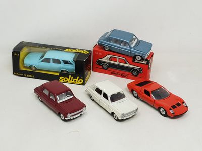 several toy cars are sitting in a box on a white surface