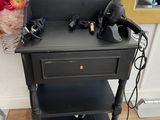 a black table with a hair dryer on top of it