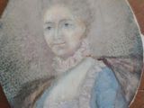 portrait of a woman in a blue dress with a white collar
