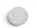 a clear glass bowl on a white surface