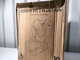 a cardboard box with a picture of a child ' s car seat in it