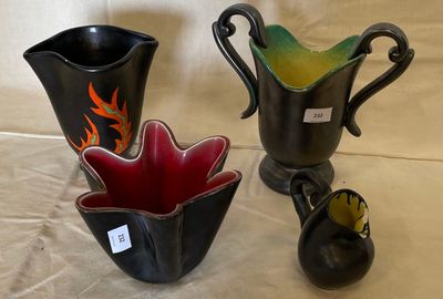 two vases sitting next to each other on a table