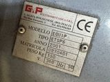 a label on the back of a machine that is sitting on the floor