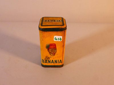 a small canister of banana juice on a white surface