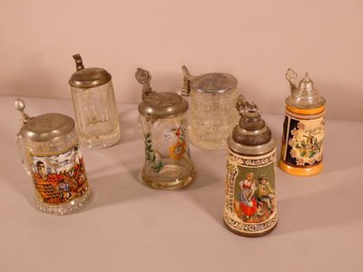 many different types of beer mugs on the table