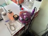 a purple machine sitting on top of a white table