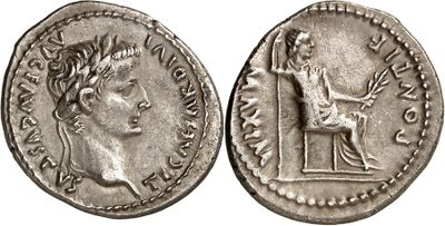 a silver coin with an image of a woman on it