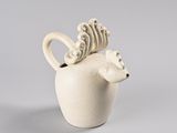 a white vase with a deer head on it