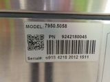 a bar code on the back of a stainless steel refrigerator