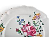 a white plate with a floral design on it