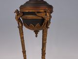 a lamp that is sitting on a table next to a remote control