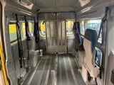 a view of the inside of a bus with the doors open