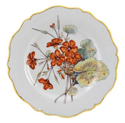 a plate with flowers painted on it on a white background