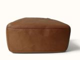 tan leather toilet bag with zippered closure on the front