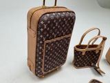 three pieces of luggage sitting on a white surface