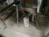 a wooden bench and a table in a garage