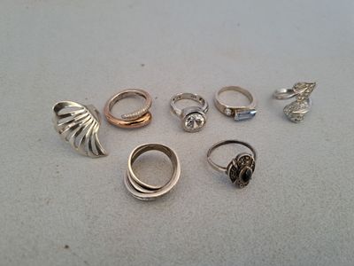 a lot of rings that are sitting on a table