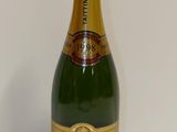 a bottle of champagne that is sitting on a table