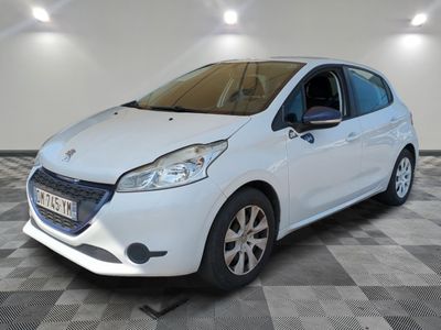 the small white car is parked in the room on a checkered floor