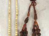 a necklace, bracelet, and ring sitting on a table