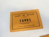 une étiquette sur laquelle on peut lire « Camp de Bitche Tanks » à côté d'une bouteille de bière
