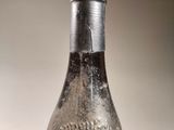 an old bottle that is sitting on a table