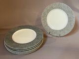 four plates stacked on top of each other on a table