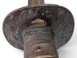 a close up of a metal object on a white surface