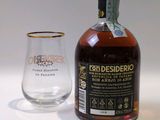 a bottle of alcohol and a glass sitting on a table