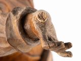 a statue of an elephant with its trunk extended