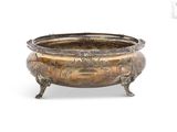 an antique silverplated bowl on stand on a white background