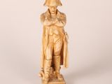 an image of a statue of a man with a hat and coat