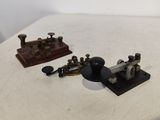 two different types of sewing machines on a table