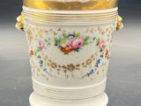 an image of a white vase with a gold rim and flowers on it
