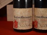 two bottles of wine that are sitting on a table