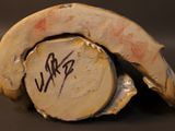 a close up of a piece of wood with writing on it