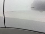 a close up of a car door handle with a sticker on it