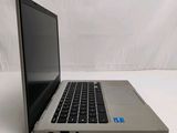 a laptop that is sitting on a white surface