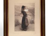 an old photo of a woman in a black dress standing in a field