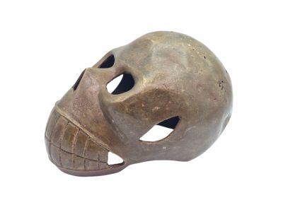 a brown skull mask with holes on the face