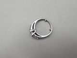 a close up of a silver ring on a table