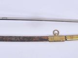 two swords that are on display on a white surface
